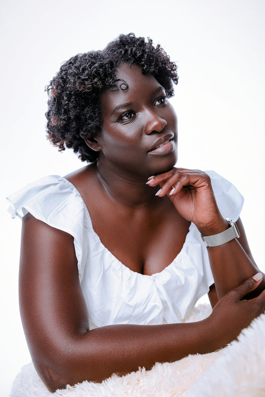 a woman in a white dress posing for a picture
