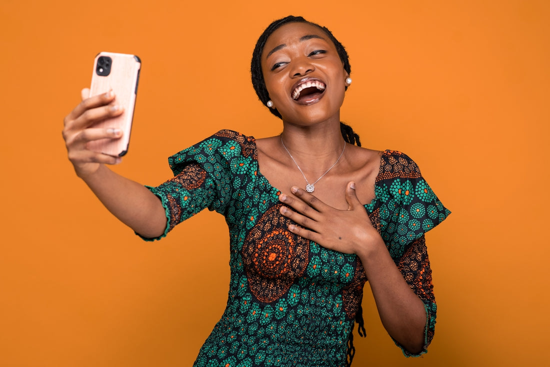 a woman taking a selfie with her cell phone